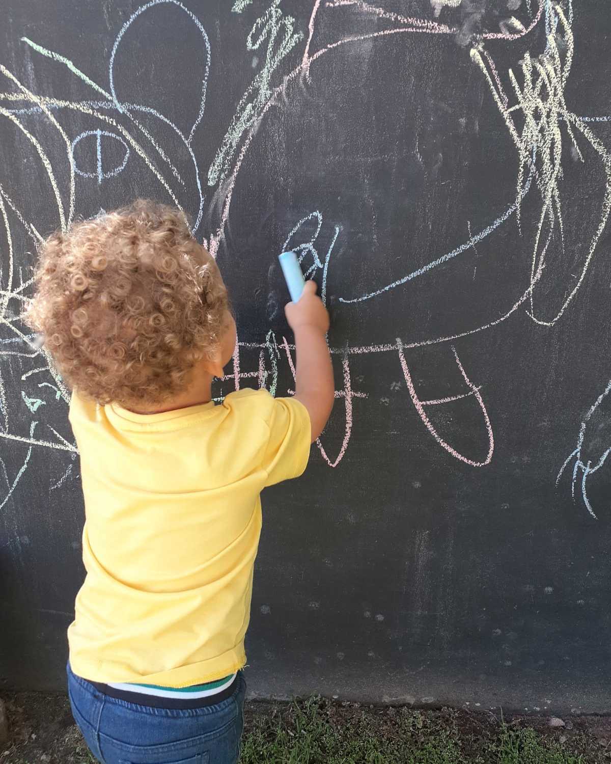 Children playing outdoors at THE OAK TREE Playschool